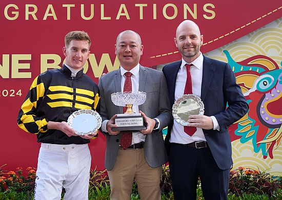 The trio with the best luck on the second day of the Chinese New Year: (from left) jockey Chad Schofield, stable representative Mr Alphonse Tranne and trainer Tim Fitzsimmons.